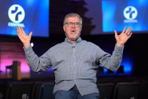 Pastor Mark Westerfield sits in his church