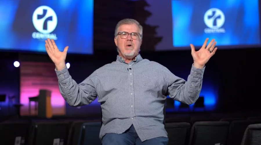 Pastor Mark Westerfield sits in his church
