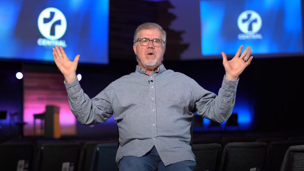 Pastor Mark Westerfield sits in his church