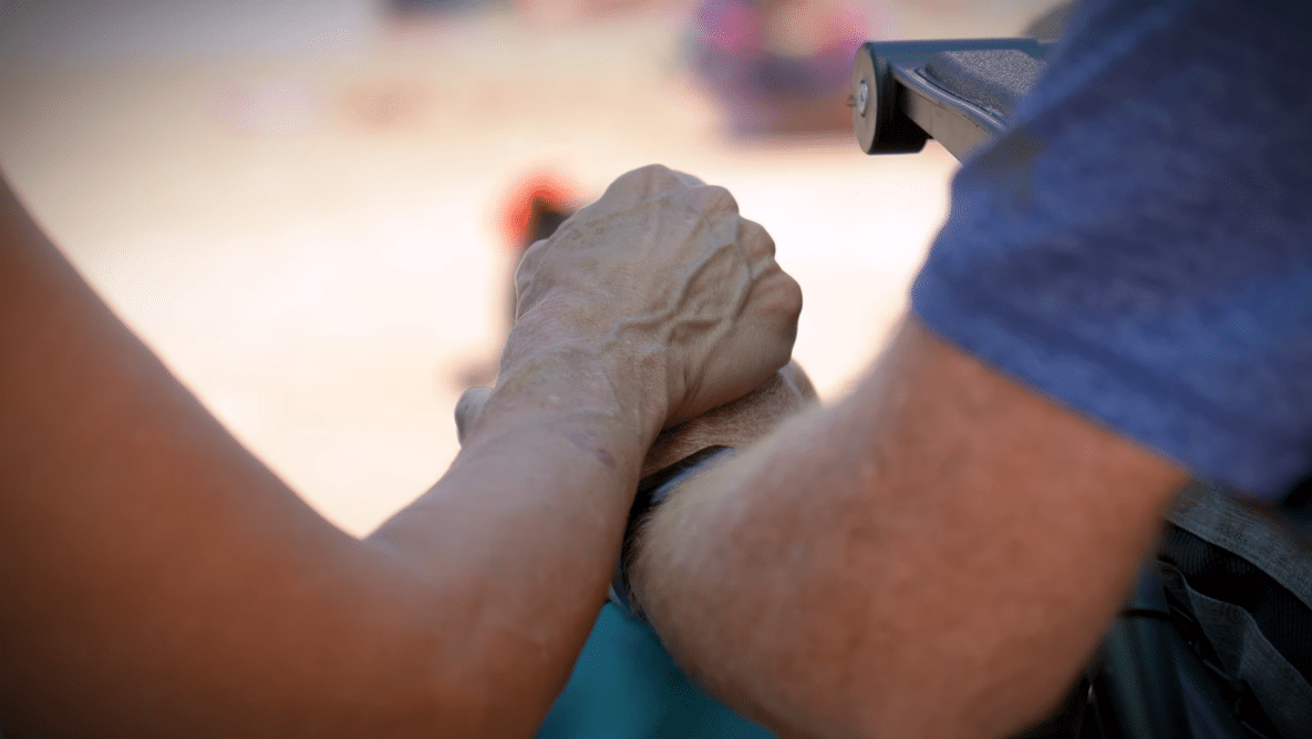 Mark and Pam Westerfield holding hands